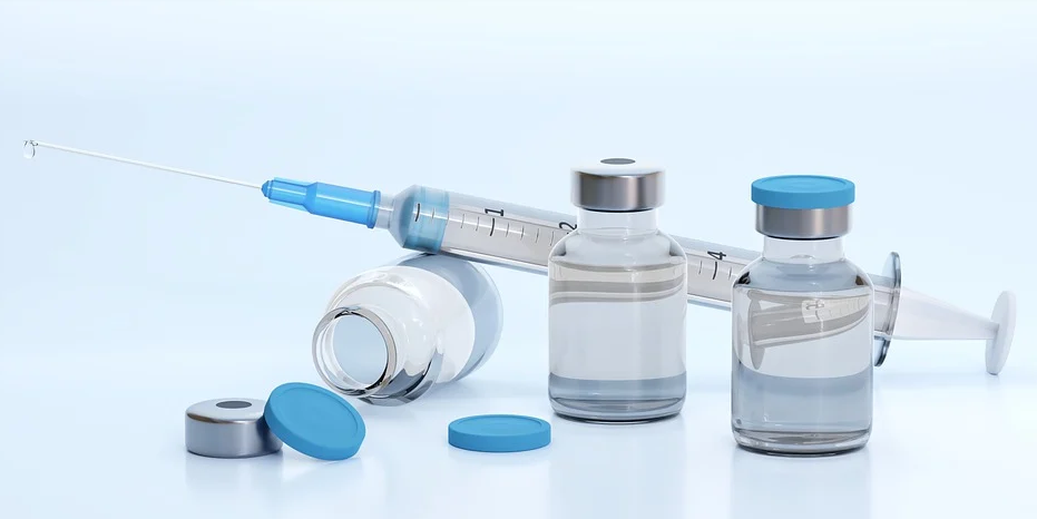 syringe with 3 bottles of vaccine